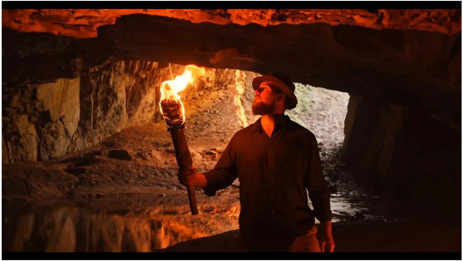 Realistic fire VFX added to a torch in a cave shot with Beeble Canvas